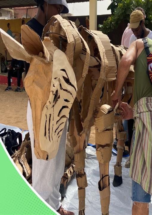 Puppet designers from Ukwanda Puppets & Design Art Collective prepared the animals for an event.